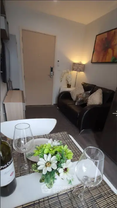 Cozy living room with elegant decor and dining setup, ideal for modern living.