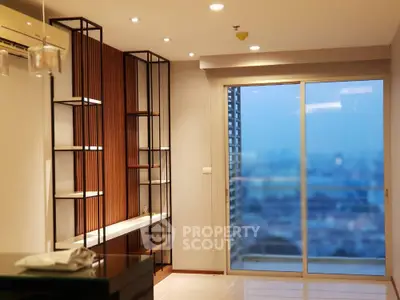 Modern living room with large window and stylish shelving unit