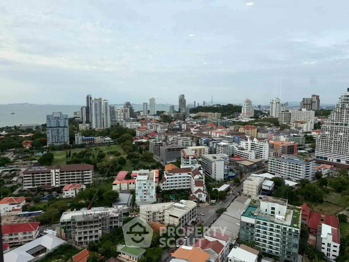 Stunning cityscape view showcasing urban skyline and lush greenery, perfect for real estate investment.