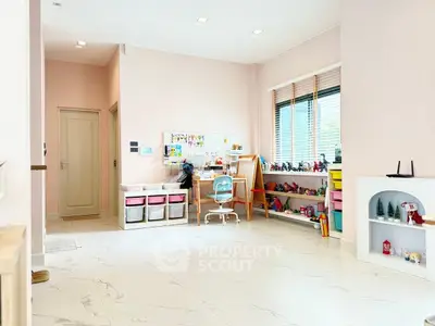 Spacious study room with modern decor and ample natural light, perfect for productivity.