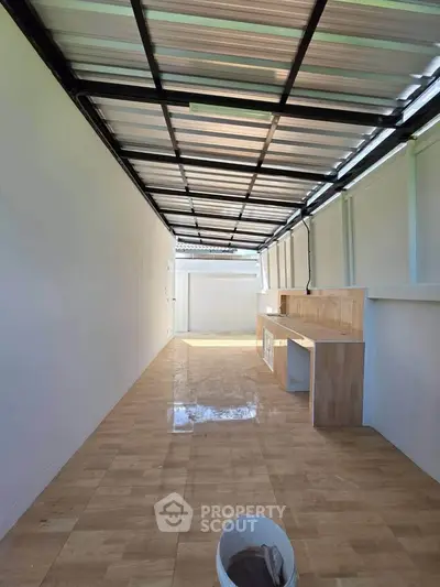 Spacious modern kitchen with sleek countertops and ample natural light