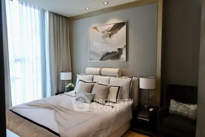 Luxurious bedroom with elegant decor and large window for natural light