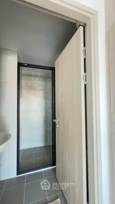 Modern bathroom with sleek shower and neutral tiles