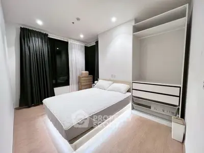 Modern minimalist bedroom with sleek design and ambient lighting