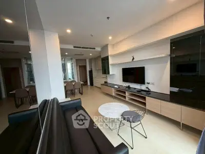 Modern living room with sleek furniture and open layout in a stylish apartment.