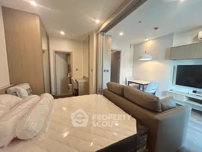 Modern studio apartment with cozy living area and stylish decor