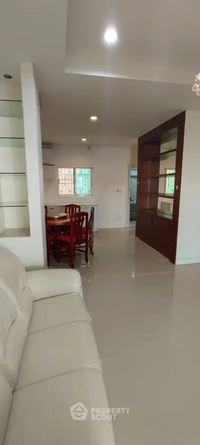 Spacious living room with elegant dining area and modern furnishings