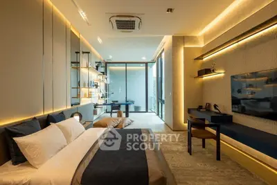 Luxurious modern bedroom with ambient lighting and stylish decor, featuring a large bed and wall-mounted TV.