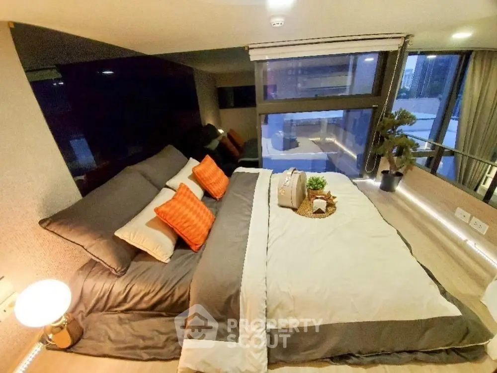 Luxurious modern bedroom with stylish decor and large window view