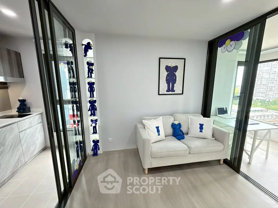 Modern living room with stylish decor and open kitchen layout in a contemporary apartment.