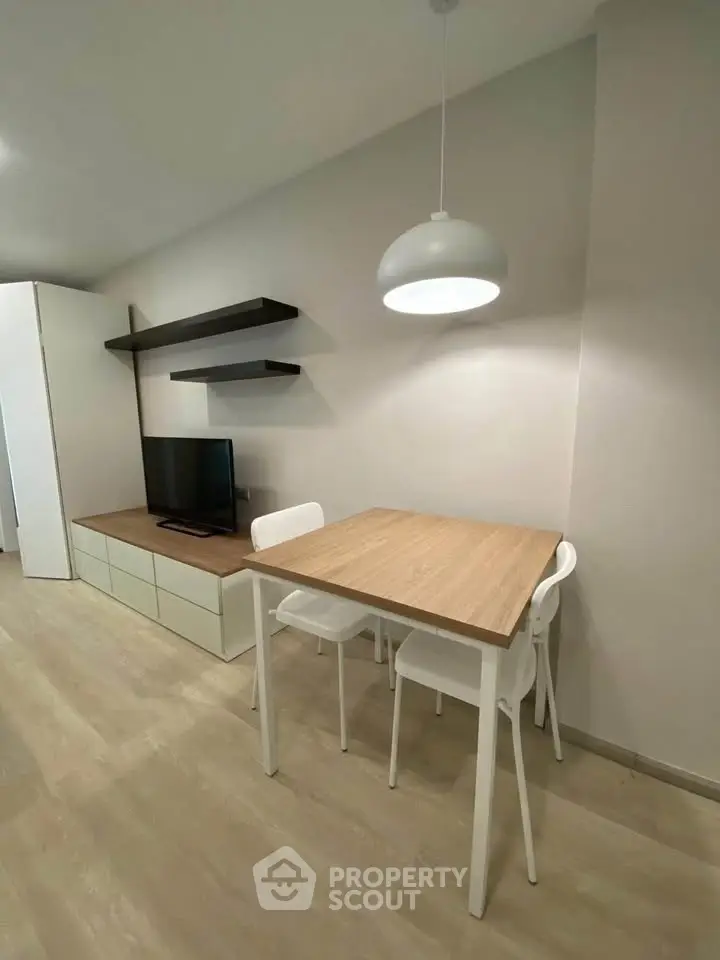 Modern living room with sleek furniture and stylish lighting, perfect for cozy gatherings.