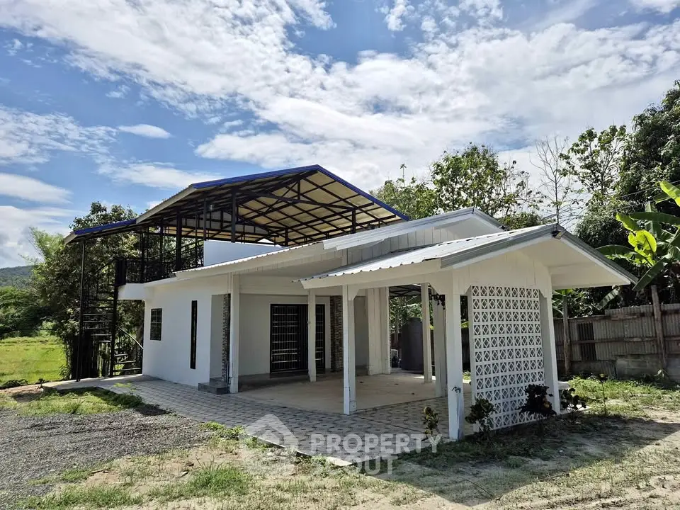 Charming modern house with spacious outdoor area and scenic views, perfect for tranquil living.