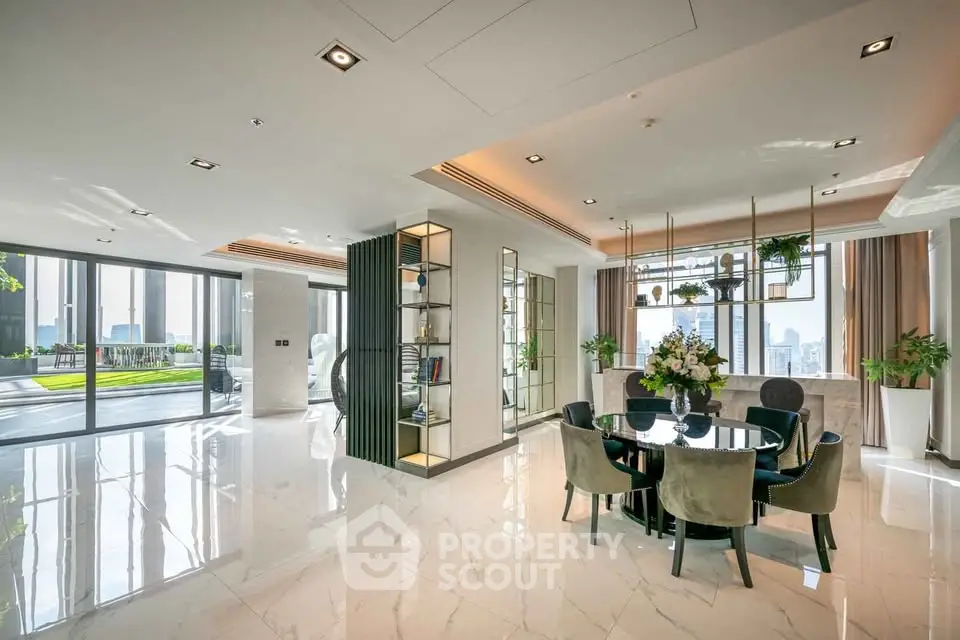 Luxurious open-plan living and dining area with city view and elegant decor