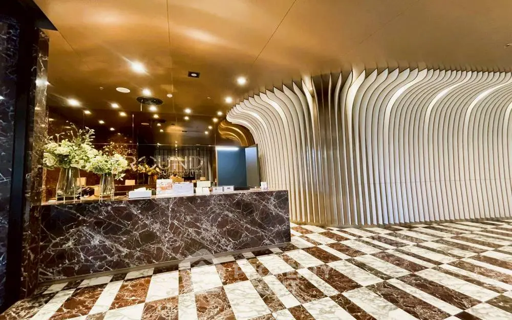 Luxurious modern lobby with marble floors and unique architectural design