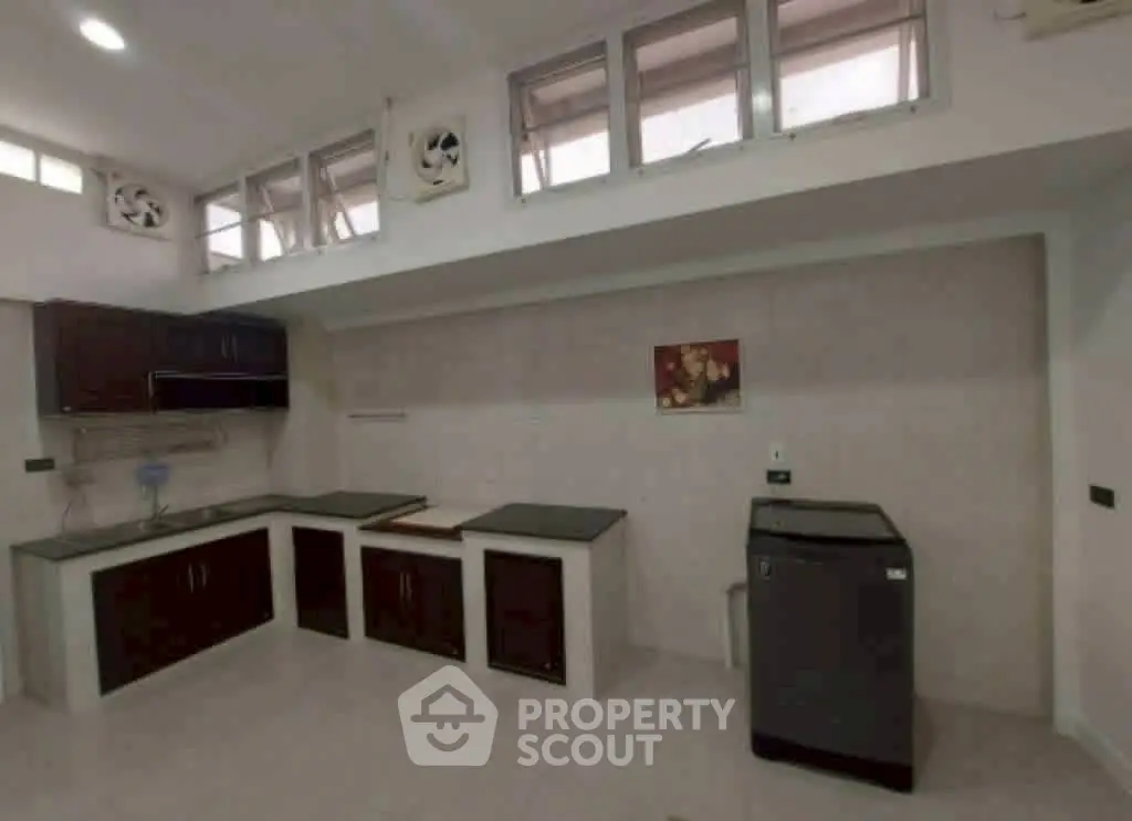 Spacious modern kitchen with sleek cabinetry and ample counter space