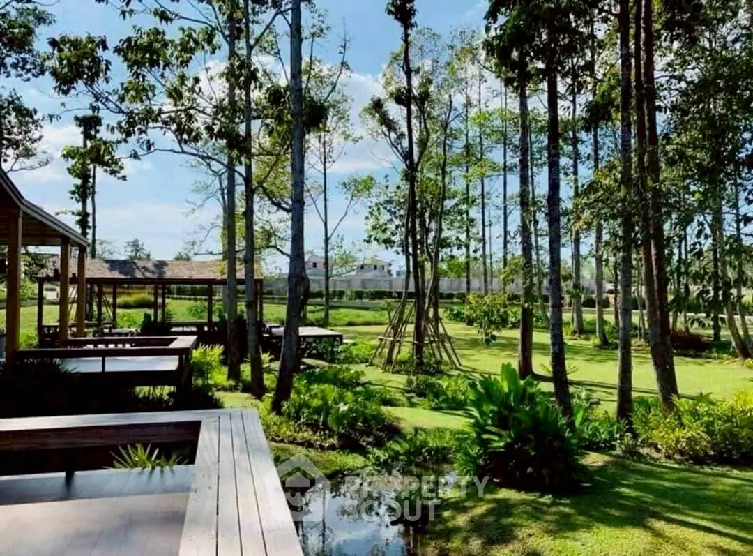 Luxurious garden view with lush greenery and modern wooden deck in serene residential area.