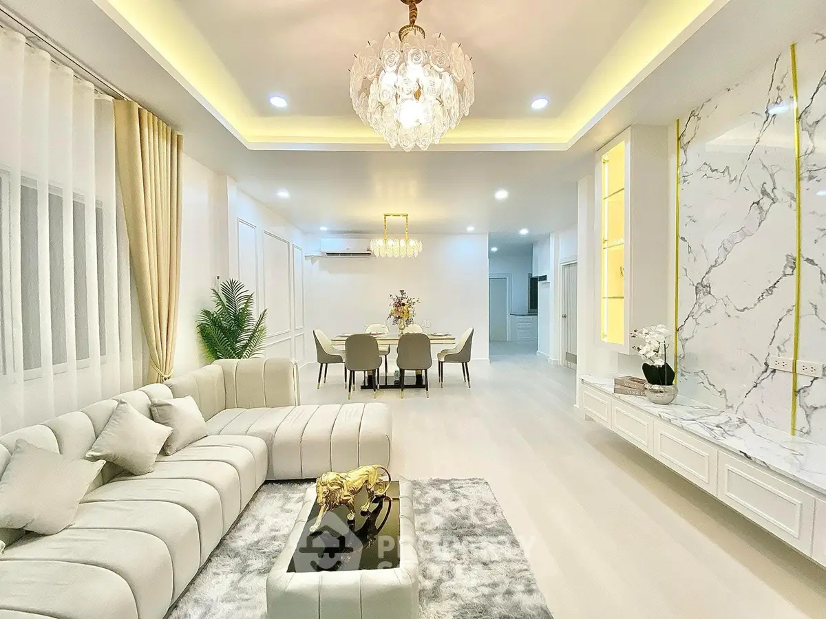 Luxurious living room with elegant chandelier and modern decor