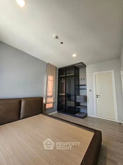 Modern bedroom with built-in wardrobe and sleek design