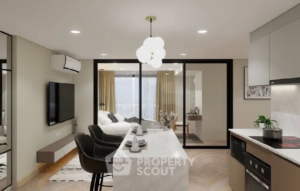 Modern open-plan kitchen and living area with sleek design and natural light.