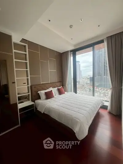Luxurious bedroom with city view, modern decor, and floor-to-ceiling windows.