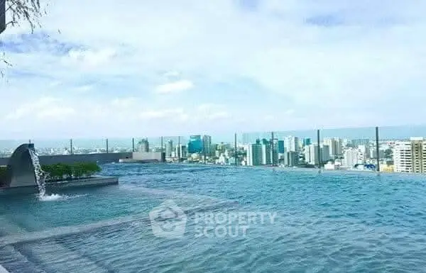 Luxurious rooftop infinity pool with stunning city skyline view