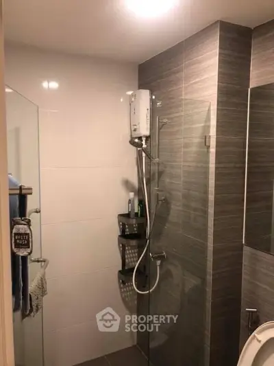 Modern bathroom with sleek shower design and neutral tiles
