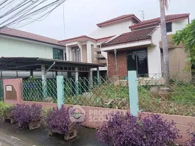 Charming suburban house with spacious garden and unique architectural design.