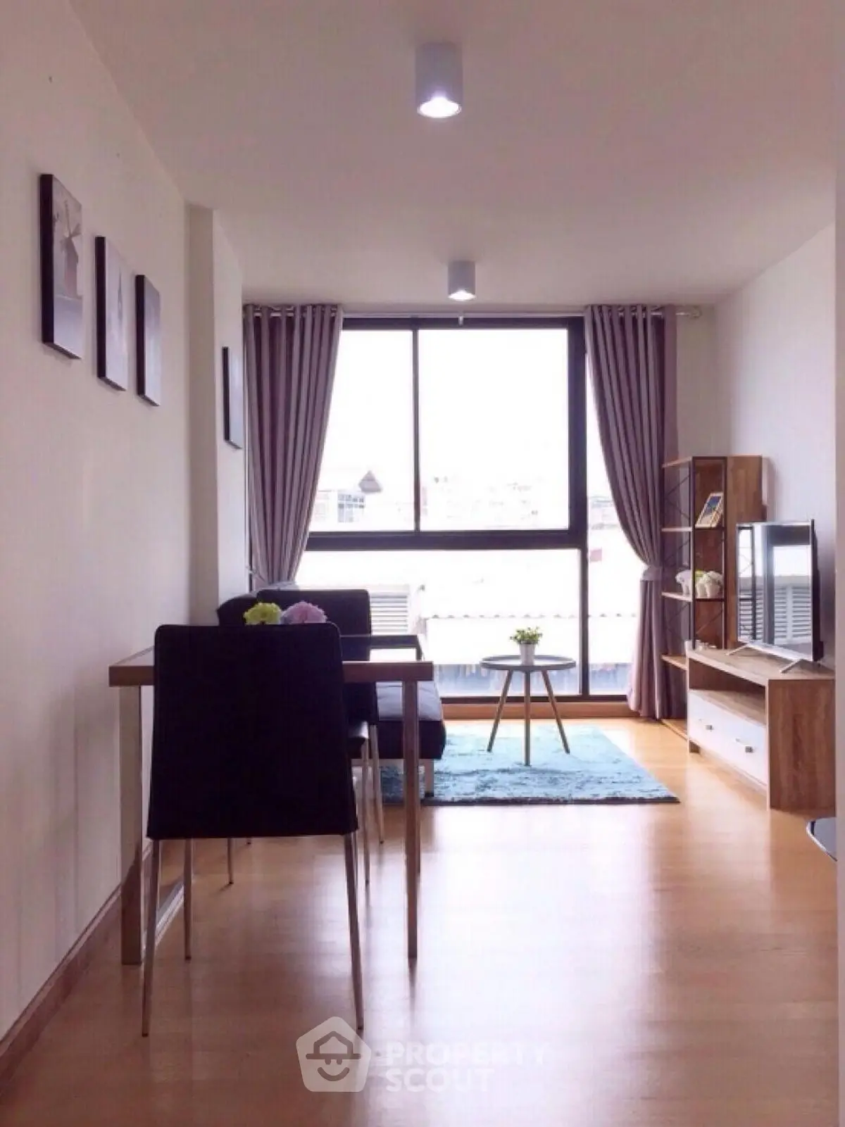 Modern living room with large window and stylish decor