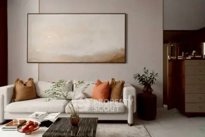 Elegant living room with modern sofa, stylish decor, and warm lighting creating a cozy ambiance.