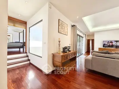 Spacious modern living room with wooden floors and elegant decor