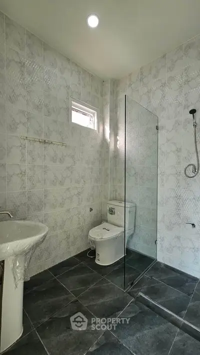 Modern bathroom with sleek design and glass shower partition