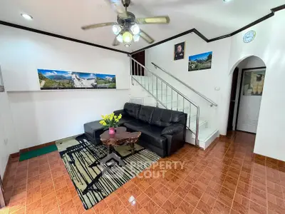 Charming living room with cozy seating and stylish decor, perfect for relaxation and entertaining guests.