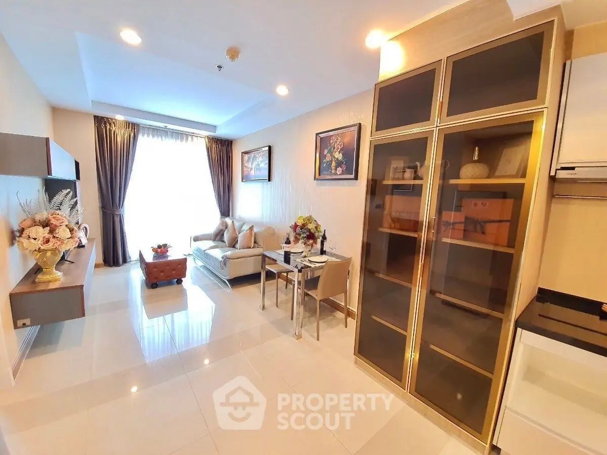 Luxurious living room with elegant decor and ample natural light, perfect for modern living.