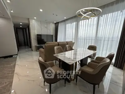 Luxurious modern living room with elegant dining area and panoramic city views.