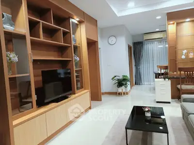 Modern living room with wooden shelves and sleek furniture