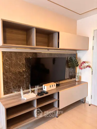 Modern living room with sleek TV unit and elegant decor