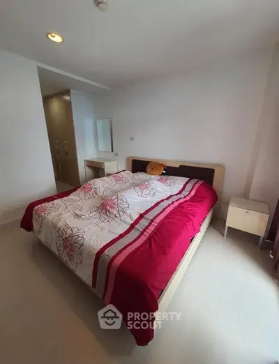 Cozy bedroom with modern decor and ample natural light