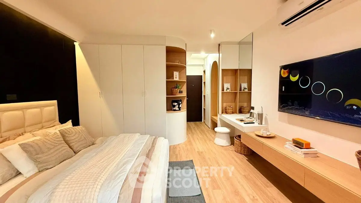 Modern bedroom with stylish decor and built-in storage solutions
