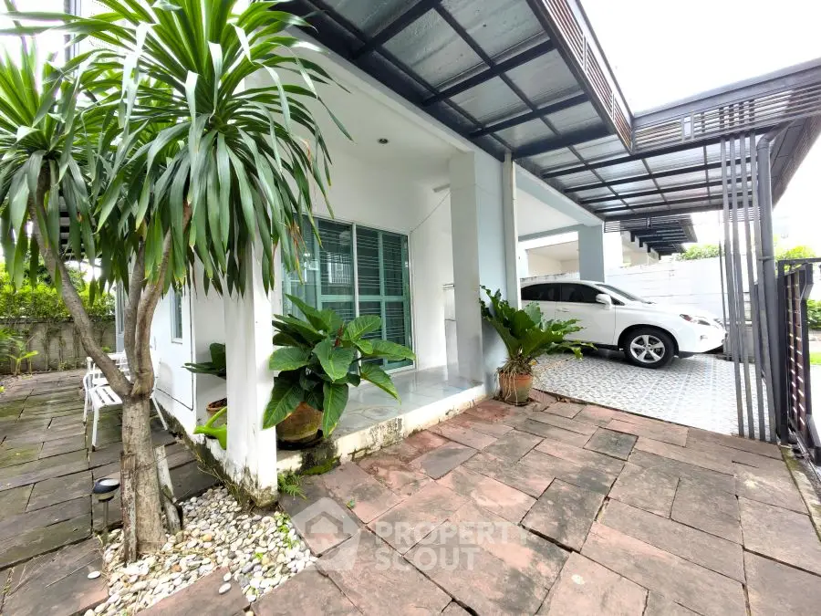 Charming modern home with spacious carport and lush greenery