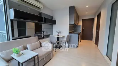 Modern living room with sleek kitchen in open layout apartment