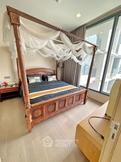 Luxurious bedroom with elegant four-poster bed and large window view