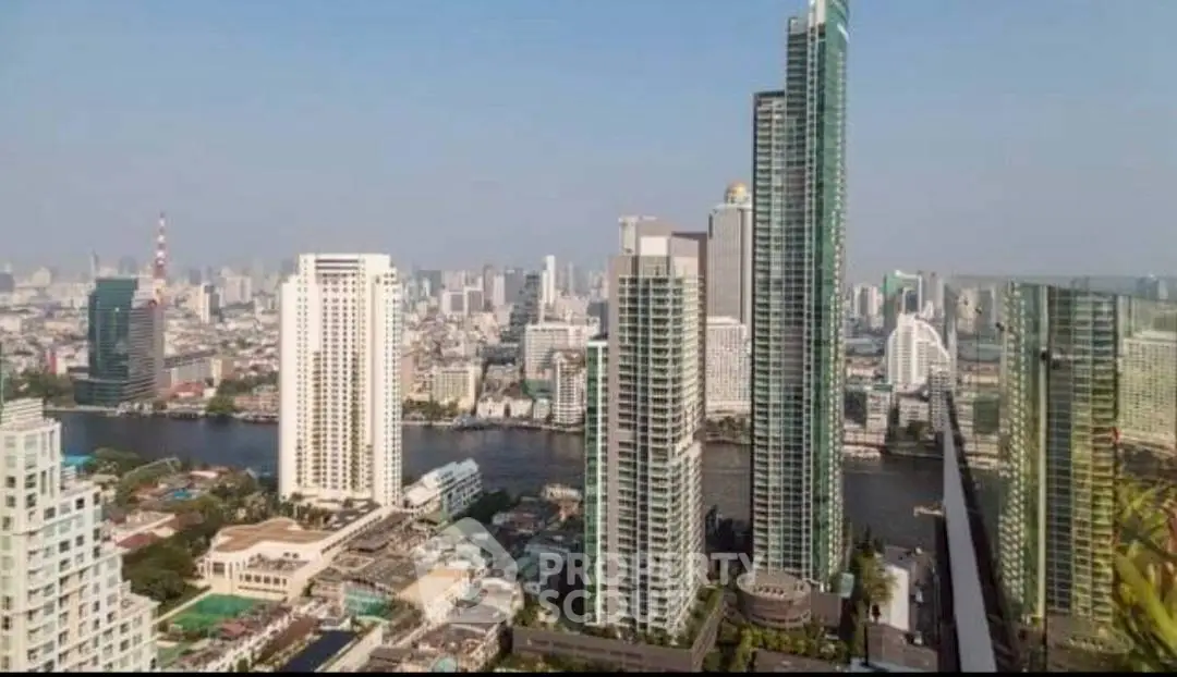 Stunning cityscape view of modern skyscrapers along a river, showcasing urban luxury living.