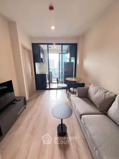 Modern living room with open layout and city view balcony