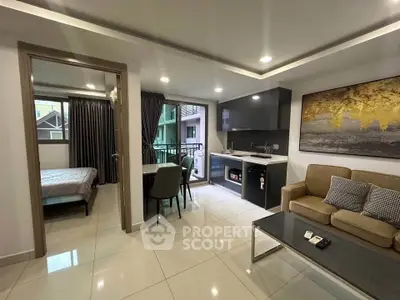Modern open-plan living room with kitchen and balcony in a stylish apartment