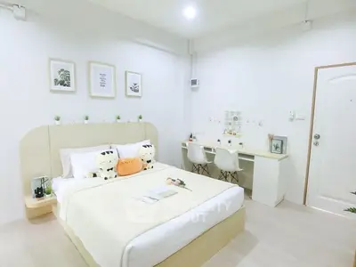 Modern minimalist bedroom with stylish decor and cozy ambiance