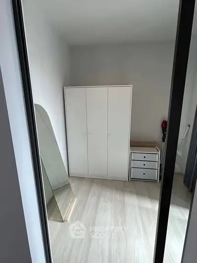 Minimalist bedroom with sleek wardrobe and modern decor