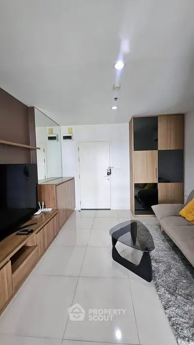 Modern living room with sleek furniture and stylish decor in a contemporary apartment.