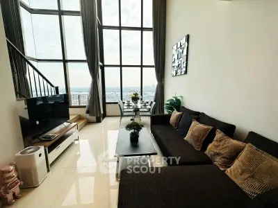 Luxurious living room with floor-to-ceiling windows and stunning city view