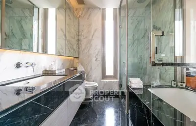 Luxurious modern bathroom with marble finishes and sleek design