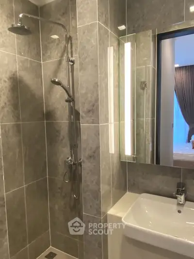 Modern bathroom with sleek shower and elegant tile design